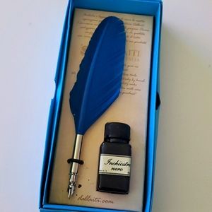 Feather pen with ink bottle